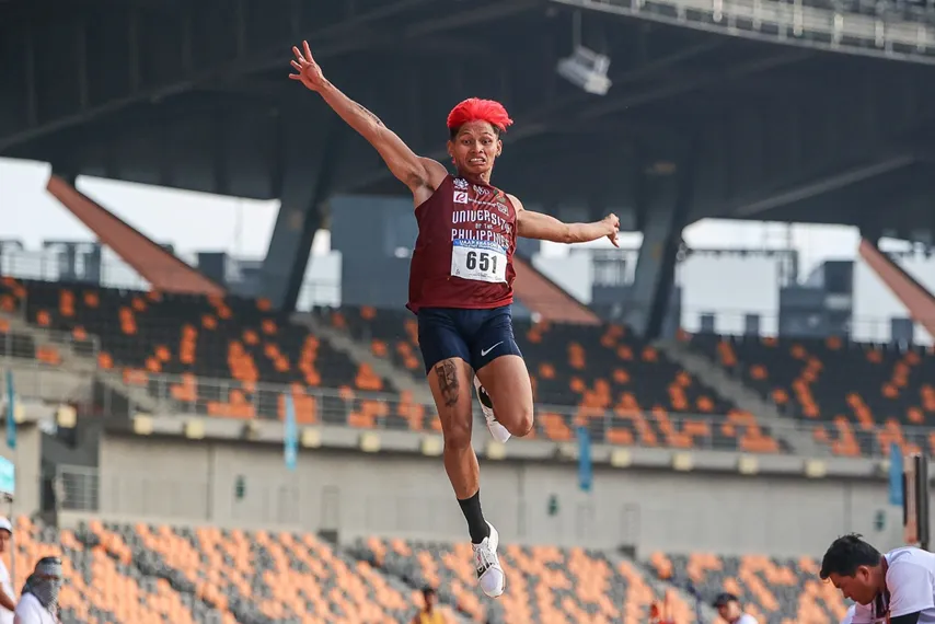 UP Men's Athletics member Clint Niño Neri completing a jump during the Collegiate Athletics Championship.