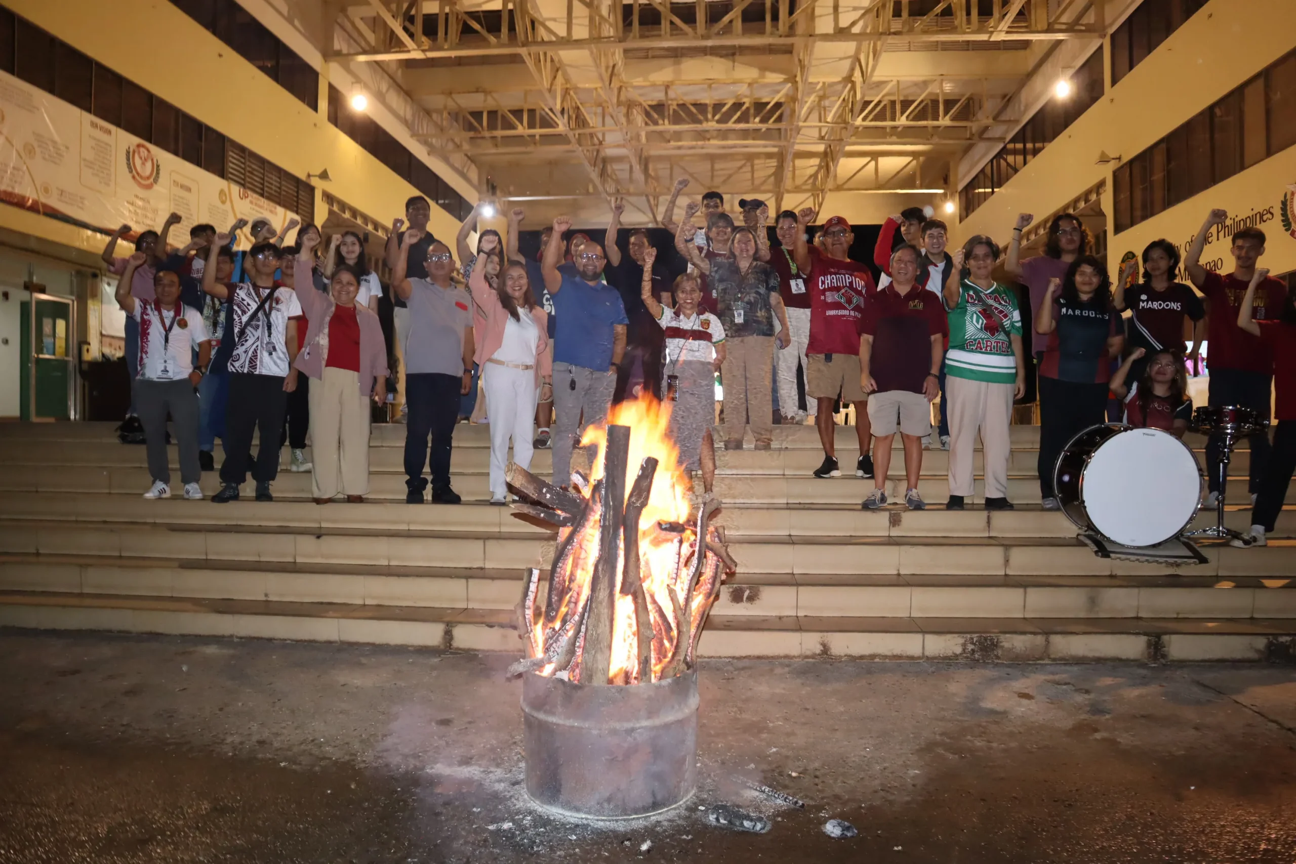 Alumni at the bonfire, celebrating the UP and UPMin basketball teams' achievements