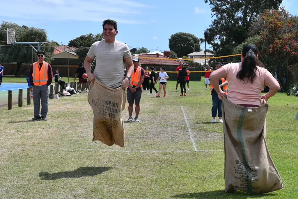 Jumping like a kangaroo to win the sack race