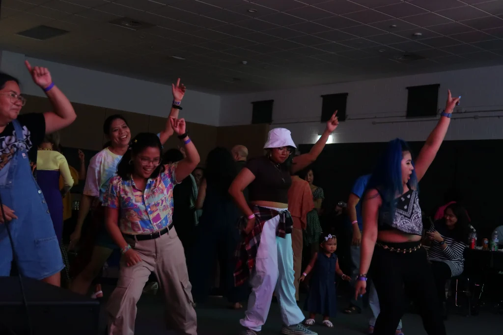 Jiving to 90s music at the Livin' La Vida 90s dinner dance.